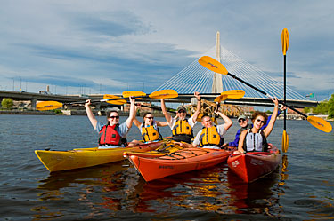 Group of Kayakers in front of Boston's Zakim Bridge.